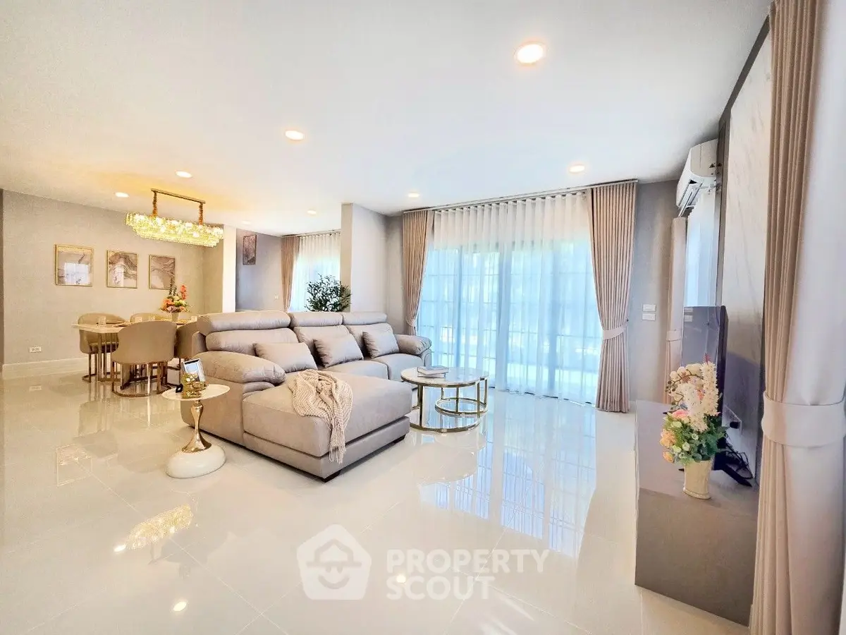 Spacious modern living room with elegant decor and large windows