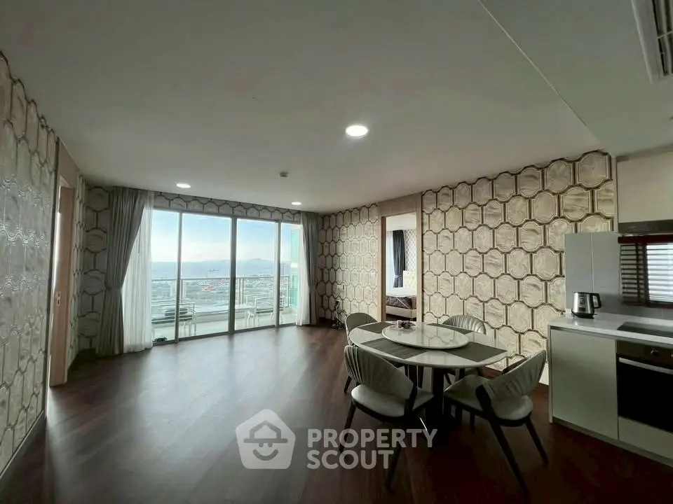 Spacious modern living room with stunning city view and elegant dining area