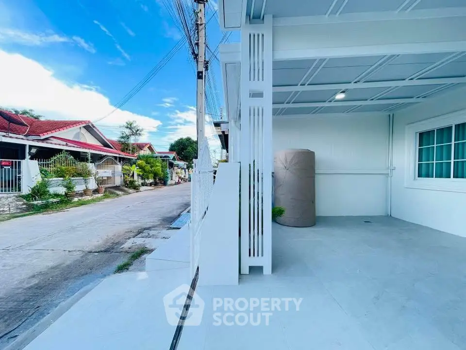 Charming suburban home with spacious driveway and modern exterior design.