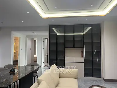 Modern living room with sleek furniture and built-in shelving