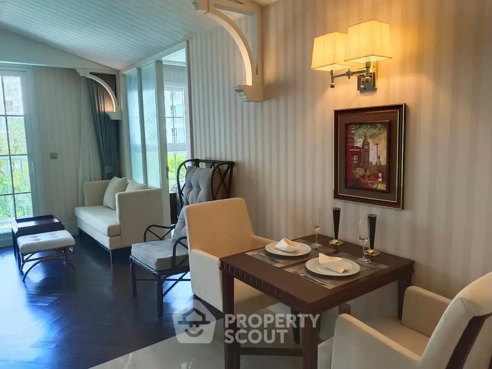 Elegant living room with dining area, featuring stylish furniture and large windows for natural light.