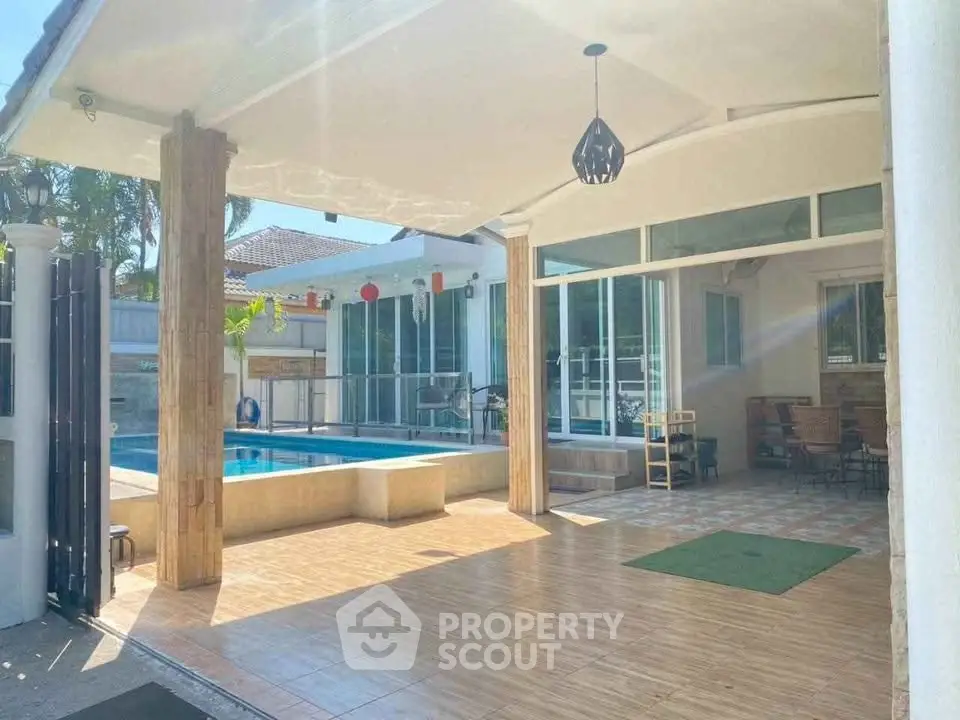 Spacious modern home with pool and patio, perfect for outdoor living.