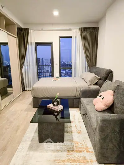 Modern bedroom with city view, featuring cozy bed and stylish decor.