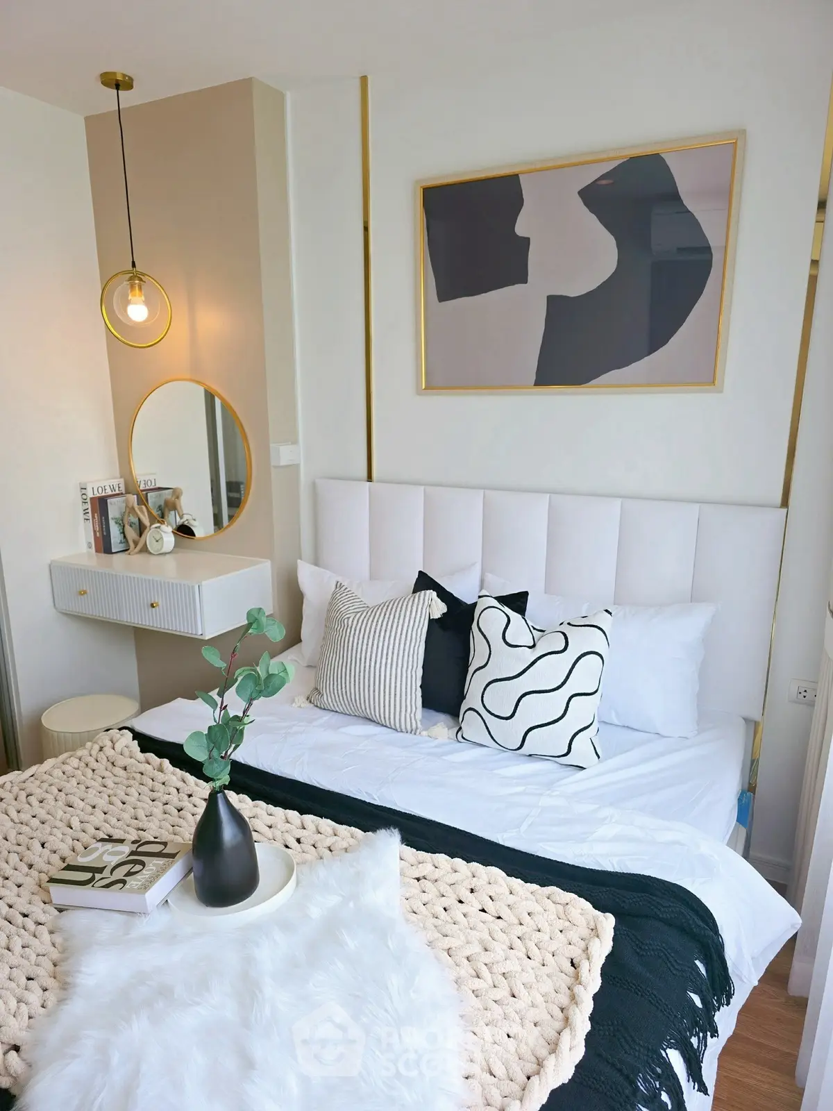 Stylish bedroom with modern decor and cozy bedding