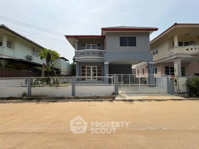 Charming two-story house with gated driveway in a serene neighborhood