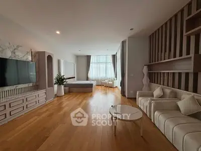Spacious modern living room with wooden flooring and elegant decor