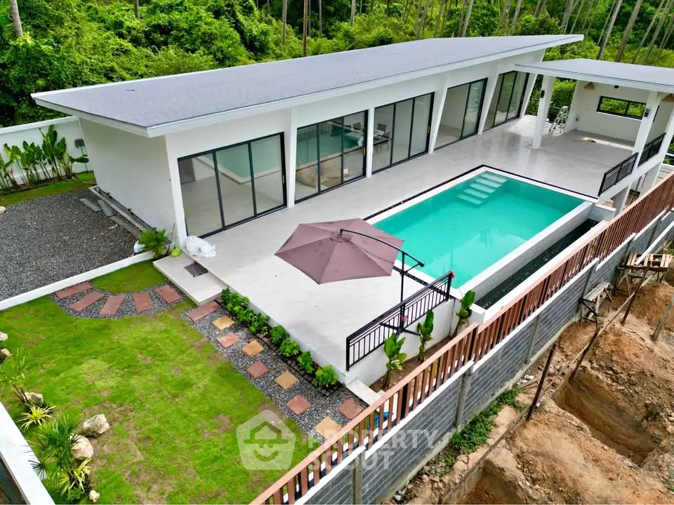 Luxurious modern villa with private pool and lush garden, perfect for serene living.