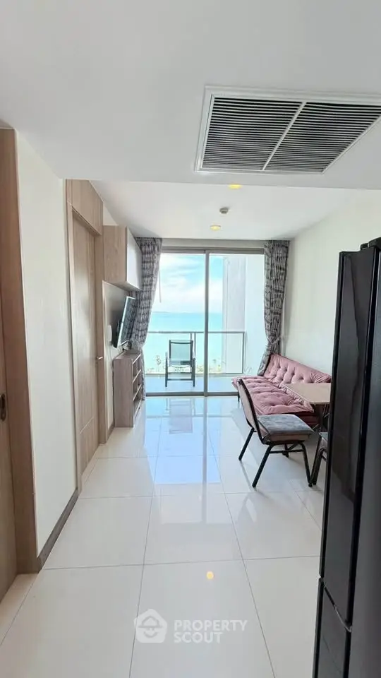 Modern living room with ocean view and stylish furniture