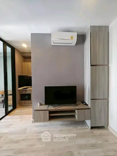 Modern living room with sleek design and air conditioning unit