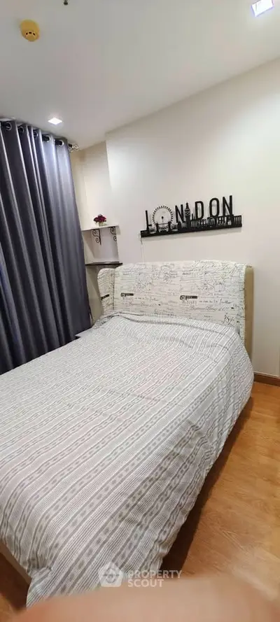 Cozy bedroom with stylish decor and large window curtains