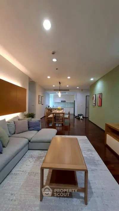 Spacious modern living room with open kitchen layout and stylish decor