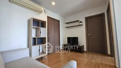 Modern living room with wooden flooring and minimalist furniture