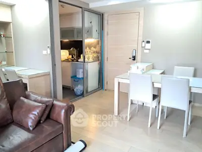 Modern living room with open kitchen and stylish furniture