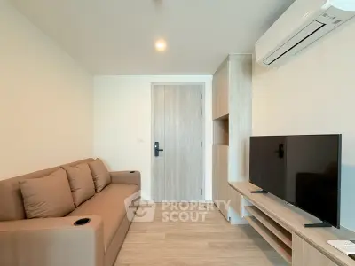 Modern living room with sleek furniture and air conditioning in a cozy apartment.