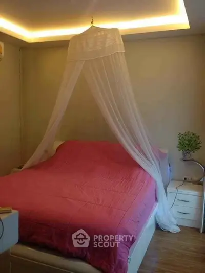 Cozy bedroom with elegant canopy bed and ambient lighting