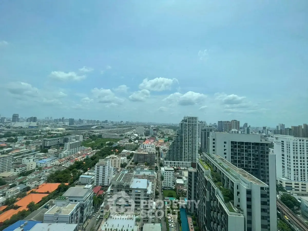 Stunning cityscape view from high-rise building showcasing urban skyline and architecture.