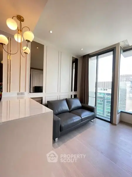 Modern living room with elegant lighting and city view balcony