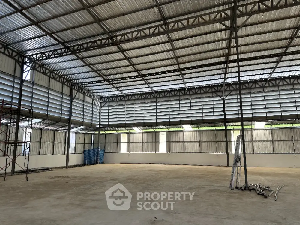 Spacious industrial warehouse with high ceilings and ample natural light