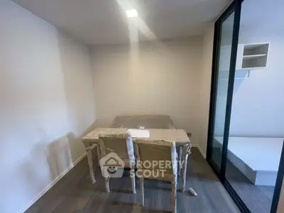 Modern study room with minimalist furniture and sliding glass door