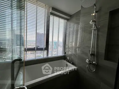 Luxurious bathroom with city view and modern fixtures