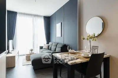 Modern living room with stylish decor and dining area in a contemporary apartment.