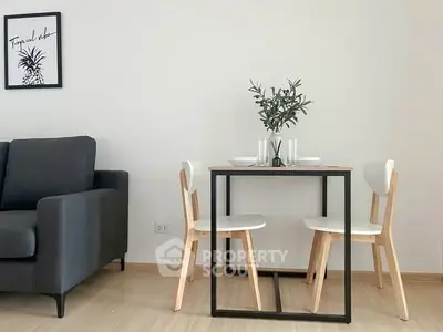 Modern living room with stylish dining set and cozy sofa