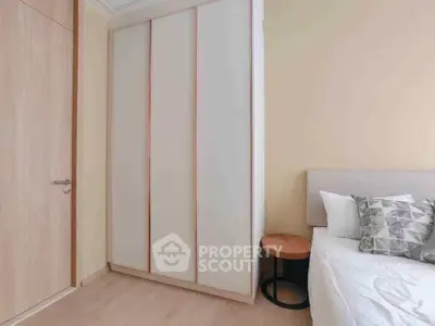 Cozy bedroom with modern wardrobe and stylish decor