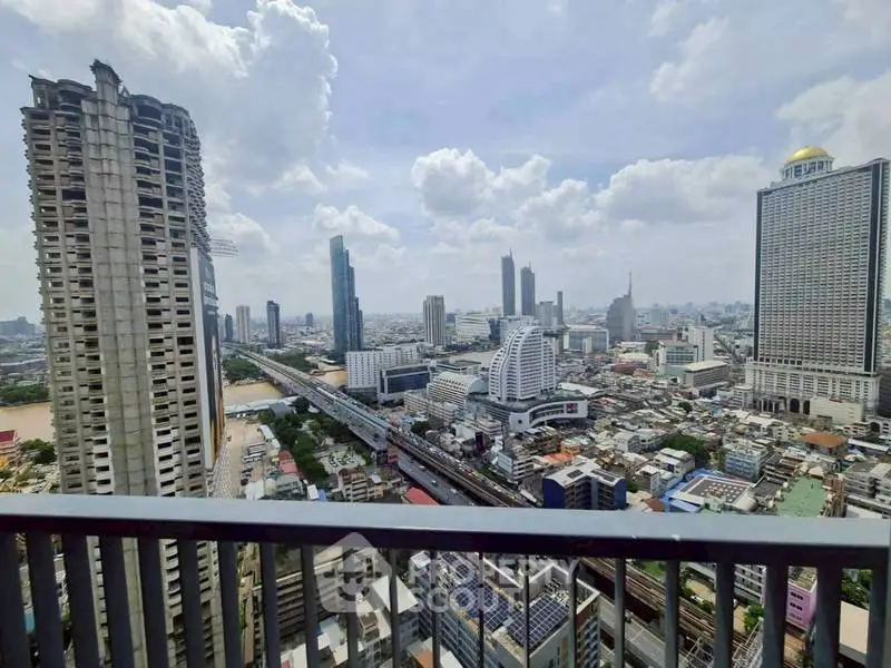Stunning cityscape view from a high-rise balcony showcasing urban skyline and modern architecture.
