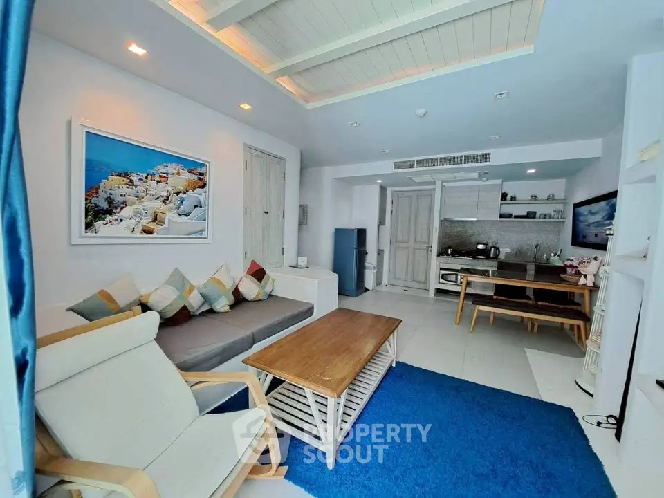 Charming living room with modern decor, cozy seating, and open kitchen layout, perfect for relaxation and entertaining.