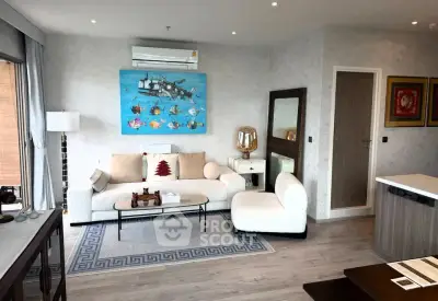 Modern living room with stylish decor and comfortable seating in a contemporary apartment.