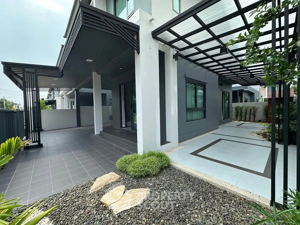 Modern house exterior with sleek design and landscaped garden
