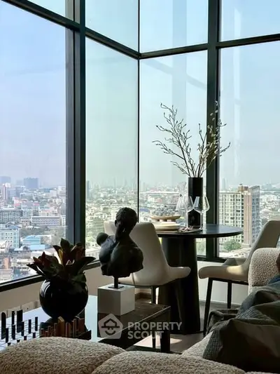 Luxurious high-rise living room with panoramic city views and elegant decor.
