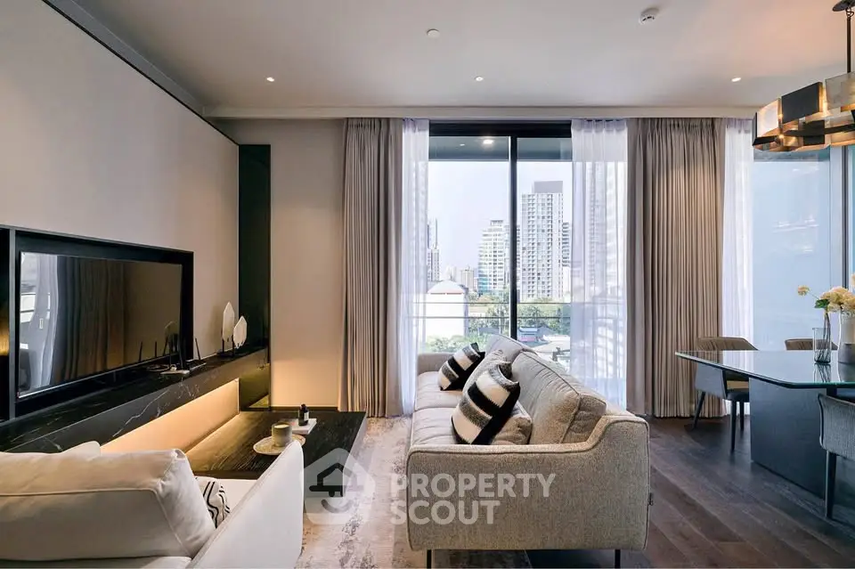 Luxurious modern living room with city view, elegant decor, and ample natural light.