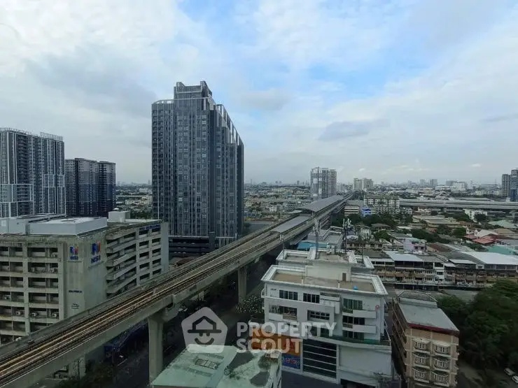 Stunning cityscape view with modern high-rise buildings and railway, perfect for urban living.