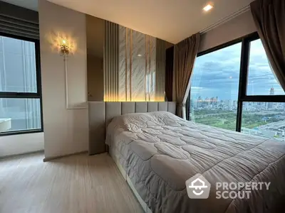 Luxurious bedroom with panoramic city view and elegant decor