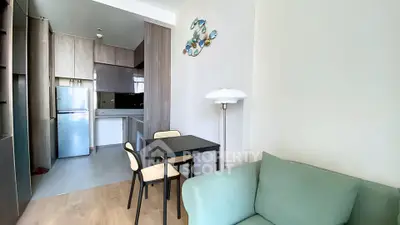 Modern living room with open kitchen and stylish decor in a cozy apartment.