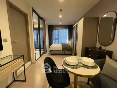 Modern studio apartment with stylish decor and cozy dining area