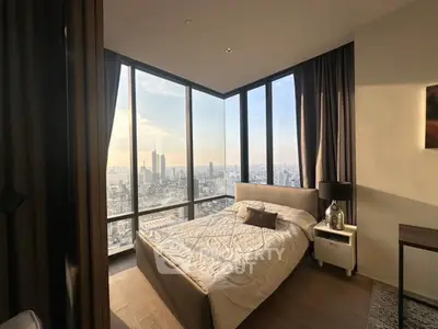 Luxurious bedroom with panoramic city view and modern decor