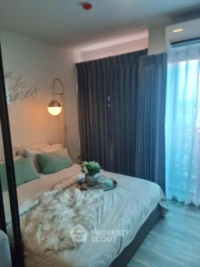 Cozy bedroom with modern decor and soft lighting, featuring a plush bed and elegant curtains.