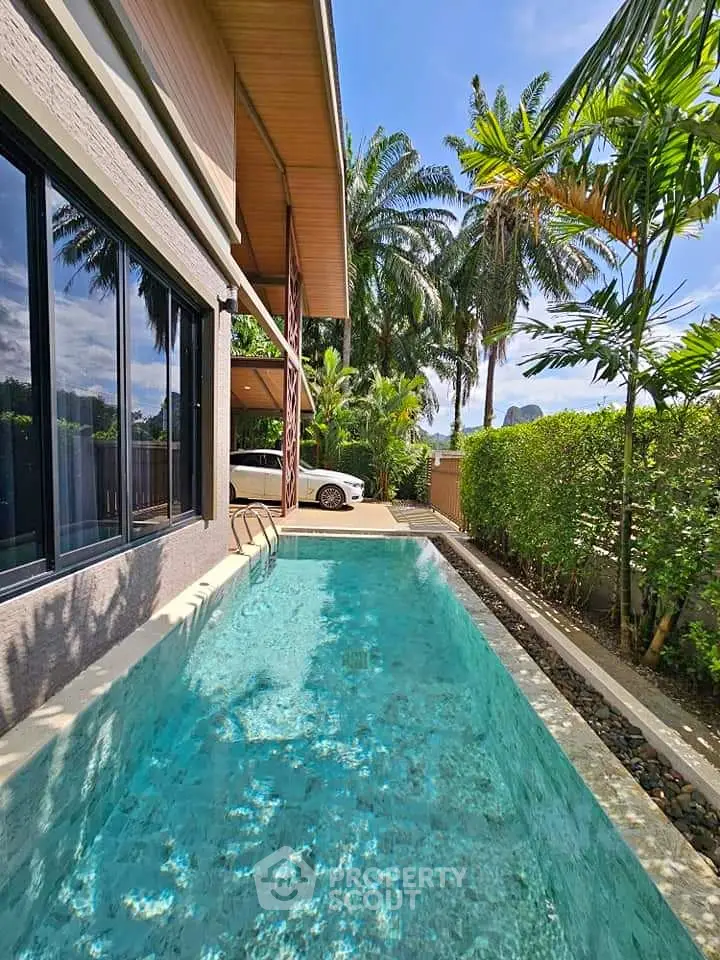 Luxurious modern home with private pool and lush tropical garden