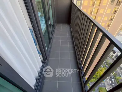 Modern apartment balcony with sleek railing and city view, perfect for urban living.