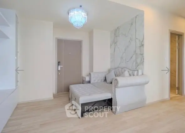 Modern living room with elegant sofa and marble accent wall