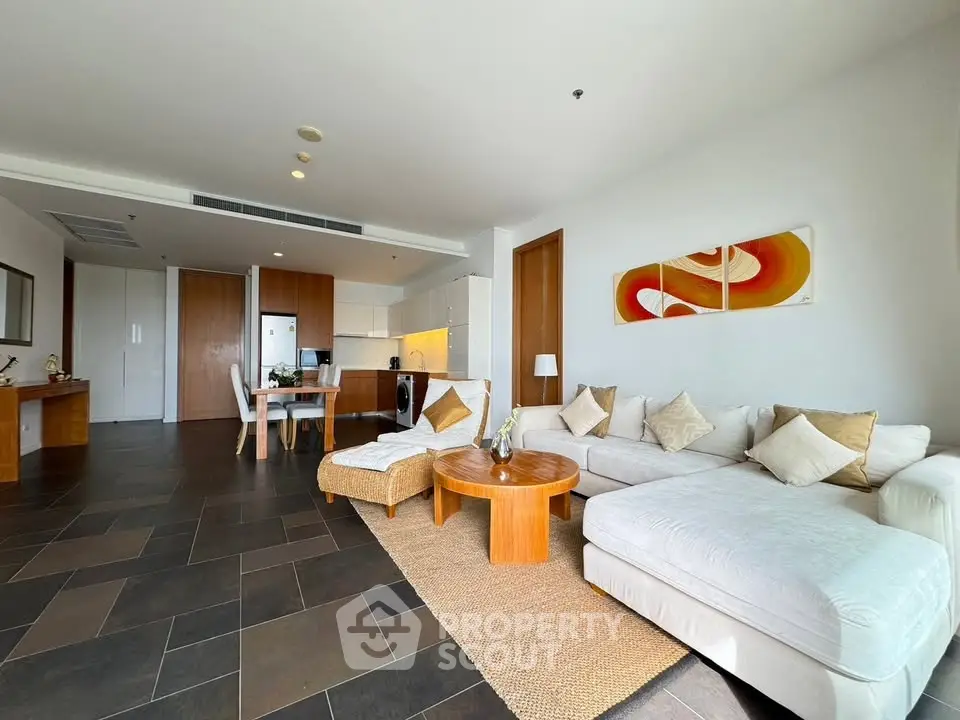 Spacious modern living room with open kitchen and stylish decor