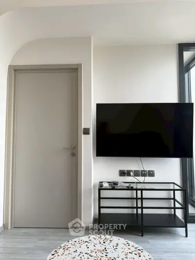 Modern living room with sleek TV setup and minimalist decor