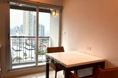 Modern apartment dining area with city view balcony