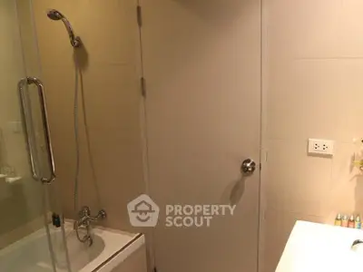Modern bathroom with bathtub and shower in a sleek design