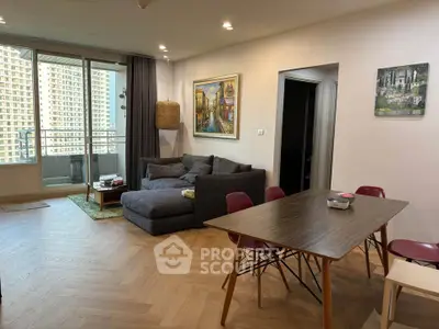Spacious modern living room with balcony view in urban apartment