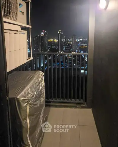 Stunning city view from a modern balcony at night, perfect for urban living.