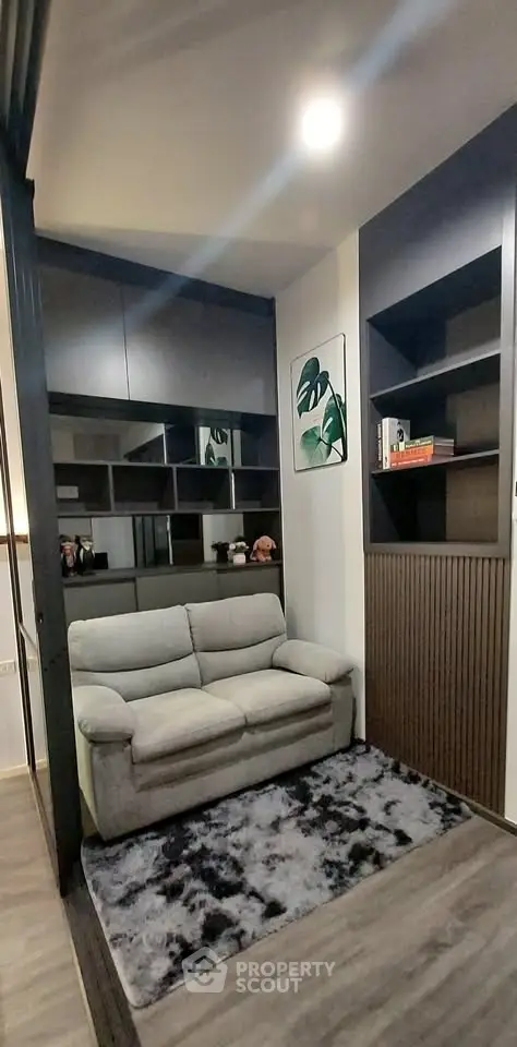 Cozy living room with modern shelving and plush sofa