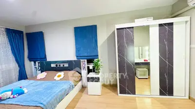 Modern bedroom with stylish decor and ample storage space